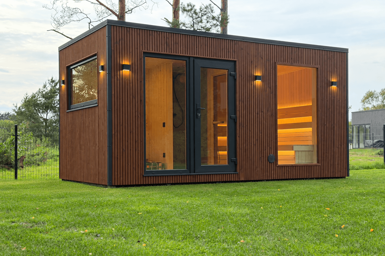 VELA insulated outdoor garden sauna with panoramic glass, shower and changing room